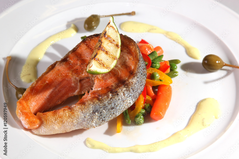 Grilled trout with vegetables and baked lime