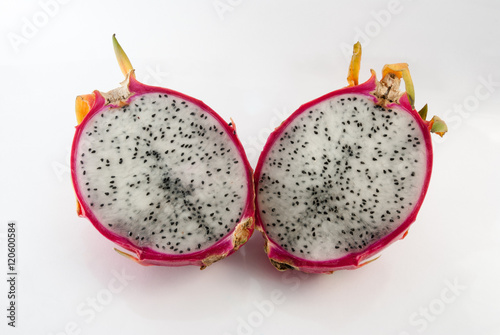 Dragon fruit cut in half on a white background closeup