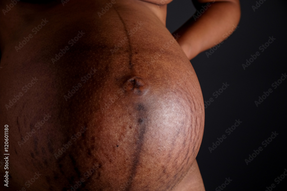 Naklejka premium Belly of a pregnant woman