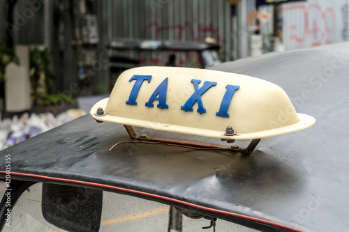 Taxi sign on car's roof