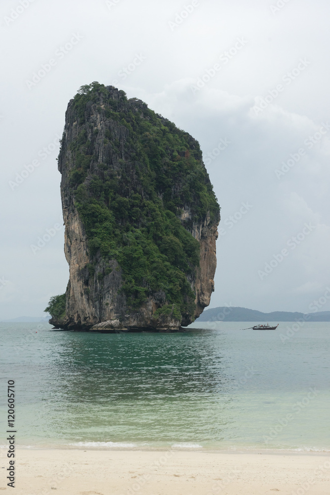 Naklejka premium Long tail boat near small stone island at Poda beach