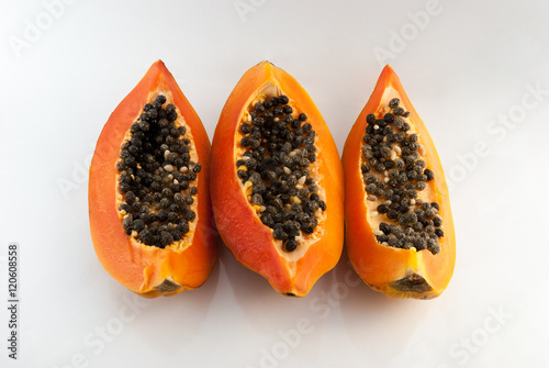 slices of sweet papaya on white background