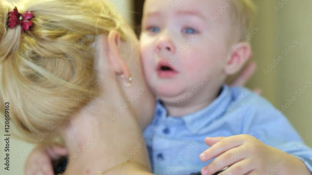 Young Mother Comforting Her Son Young Mother Comforting Her Son