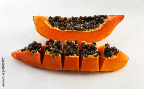 slices of sweet papaya on white background
