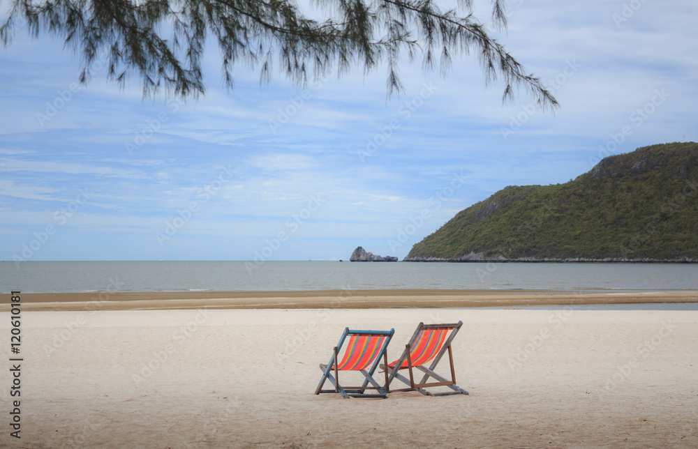 rainbow summer two beach chairs for relax on the beach in vacation time rainbow summer two beach chairs for relax on the beach in vacation time