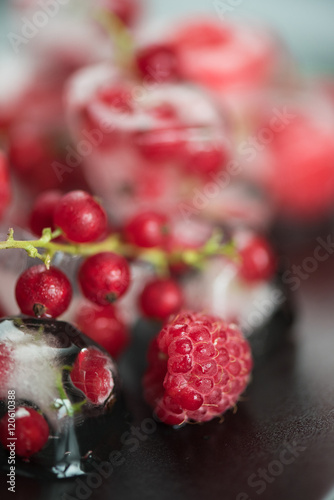 Frozen berries on wooden table