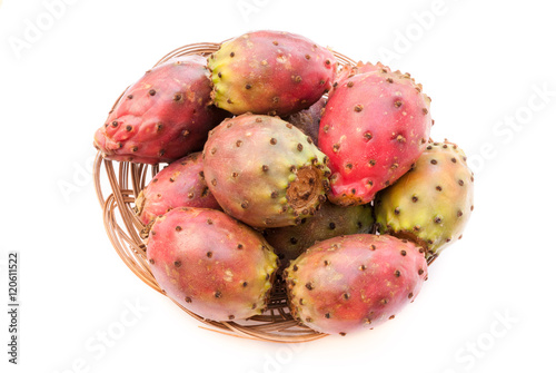 prickly pear (opuntia) fruits in the wicker plate closeup isolat photo