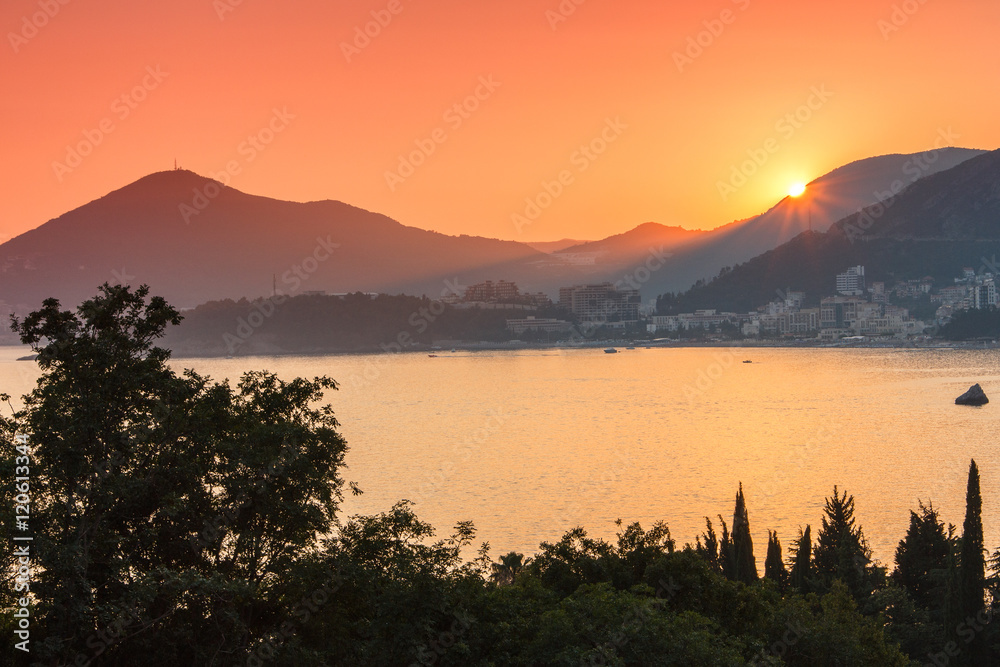 View of the Mediterranean sea and Budva at colorful sunset. Montenegro. 