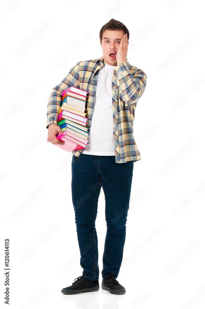 Full lenght portrait of shocked teenager with books. Male student expressing shocking emotions. Young man holding textbooks isolated on the white background. Full lenght portrait of shocked teenager with books. Male student expressing shocking emotions. Young man holding textbooks isolated on the white background.