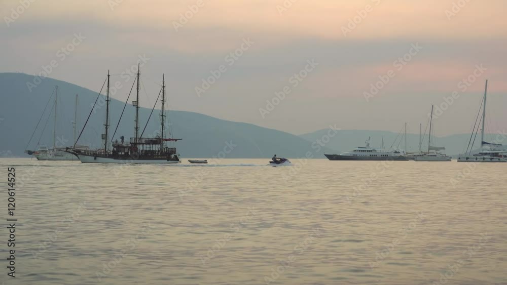 Sunset Regatta of Sailing boats in the Boka bay, Montenegro, Adriatic, in 4k ultrahd Sunset Regatta of Sailing boats in the Boka bay, Montenegro, Adriatic, in 4k ultrahd
