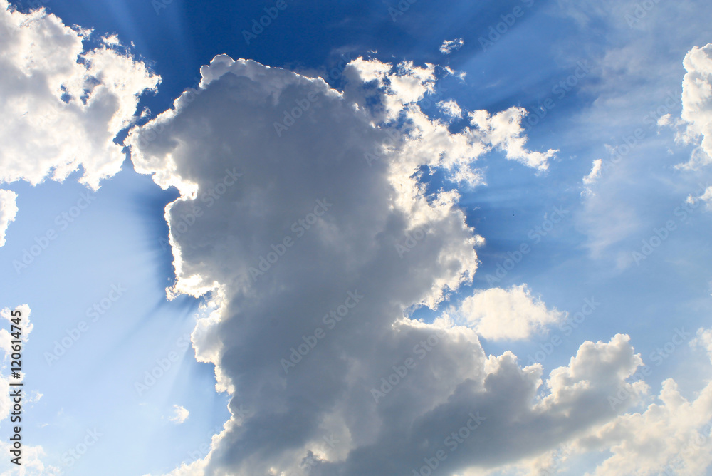 Sun rays shining through clouds StockFoto Adobe Stock