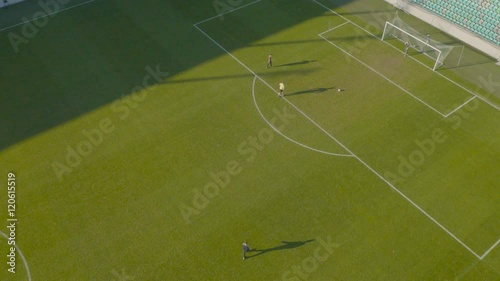 Aerial view how player miss a penatly at empty soccer stadium
