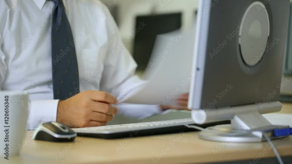 Timelapse shot of businessman working at office desk Timelapse shot of businessman working at office desk