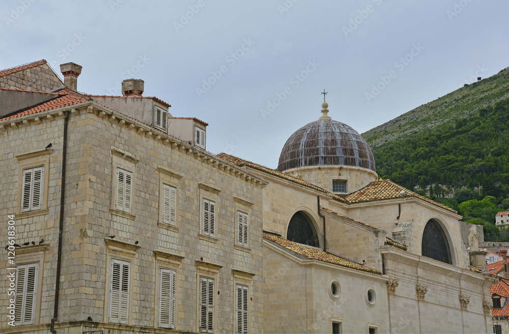 The historic Adriatic town of Dubrovnik. Big Onofrio's Fountain can be seen in the foreground, with the 14th century belltower of the Franciscan Monastery in the background.
