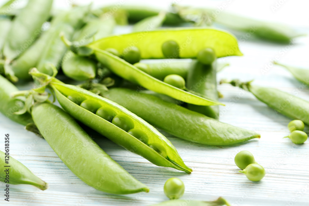 Green peas on a blue wooden table Green peas on a blue wooden table