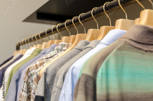 Various Men's Clothing On A Wooden Hanger. CloseUp shot with small GRIP.