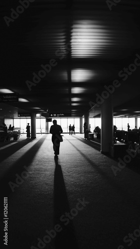 a man walking into the light,light and shadow,dark edges,light of life concept