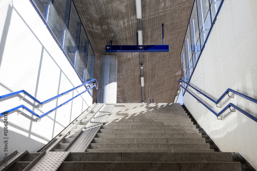 Fototapeta premium stairs with Ramps for strollers and bicycles at the railway station