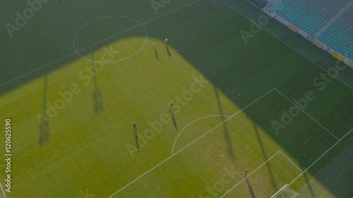 Aerial, player dribble and try to pass a ball to teammate
