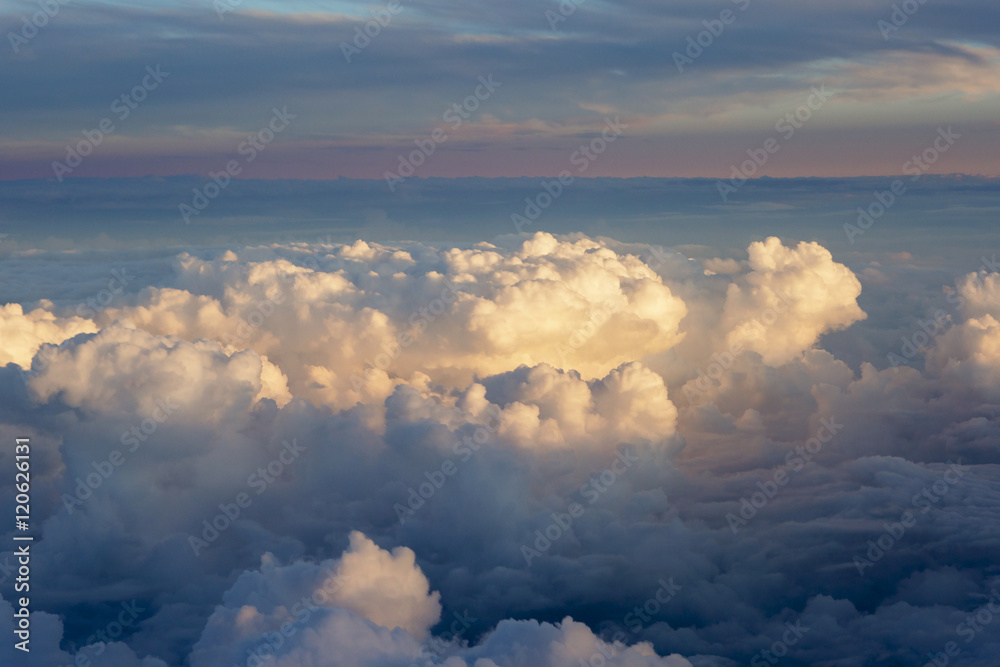 Aerial view of thick clouds over the land, the landscape. The texture of the scenic sky during sunset. Aerial view of thick clouds over the land, the landscape. The texture of the scenic sky during sunset.