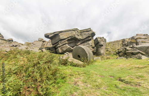 Abandoned millstones at Stanage Edge in Derbyshire, England.