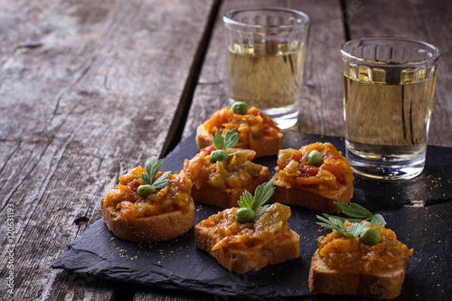Canape with eggplant caviar and glasses of wine