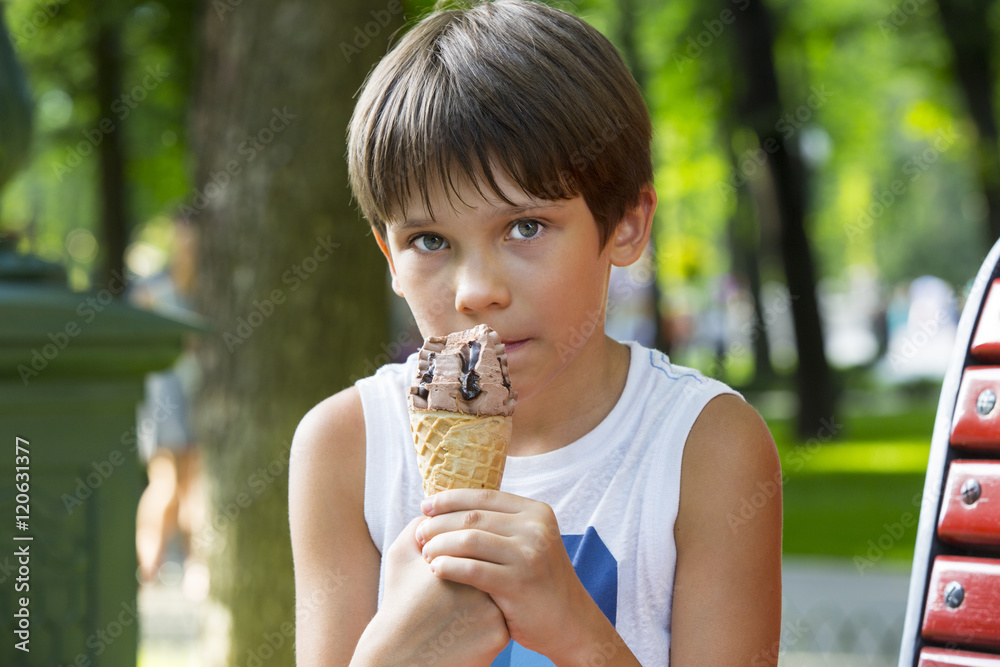 little boy eating an ice cream dessert little boy eating an ice cream dessert