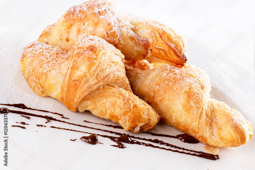 croissants on white plate isolated on the white background