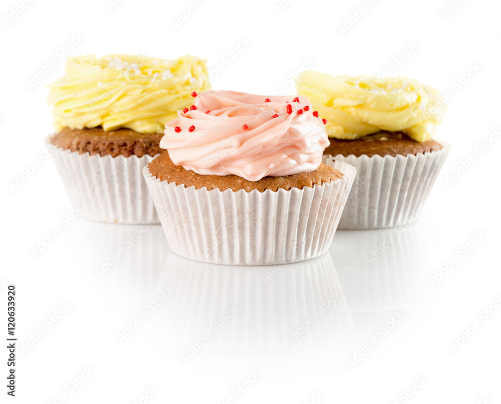 cupcakes with cream isolated on the white background