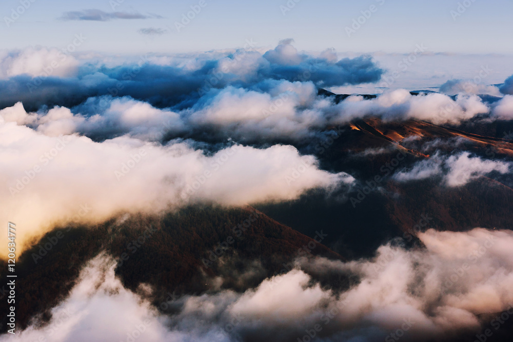 Clouds covering mountains