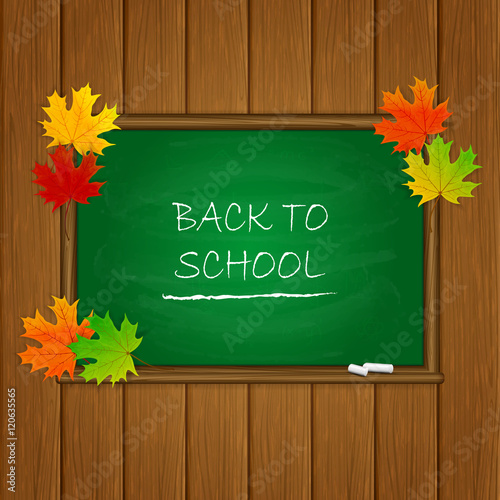 Back to School and maple leaves on green chalkboard