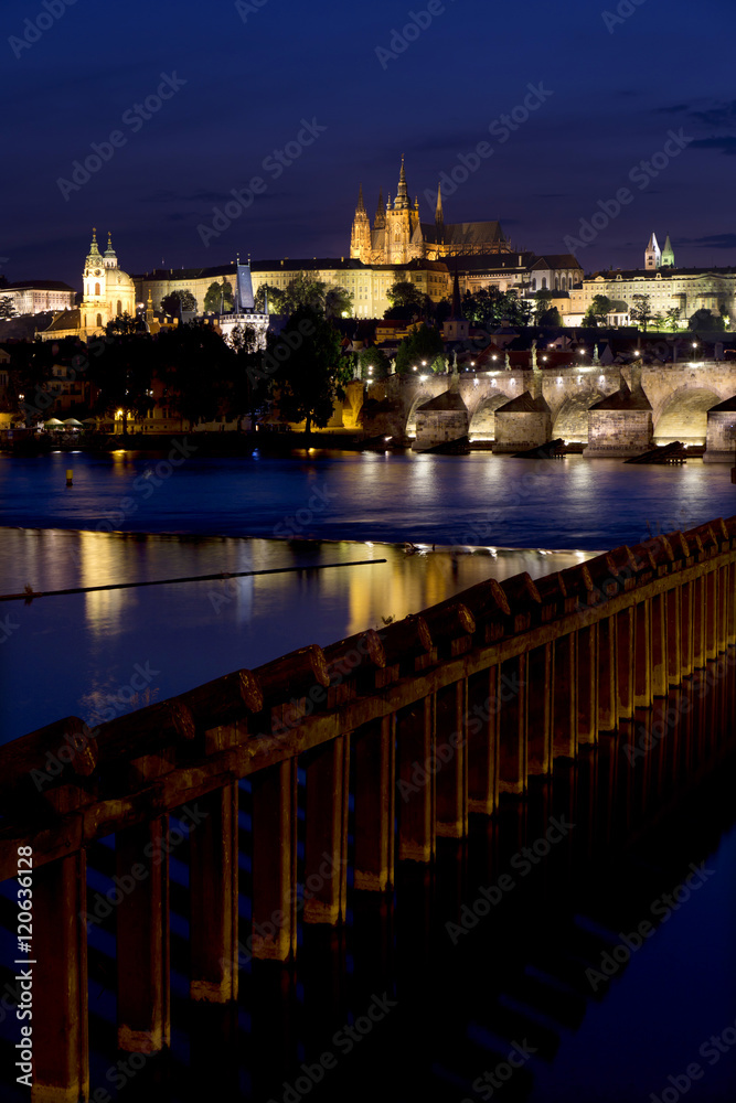 Night colorful Prague gothic Castle above the River Vltava with Charles Bridge, Czech Republic