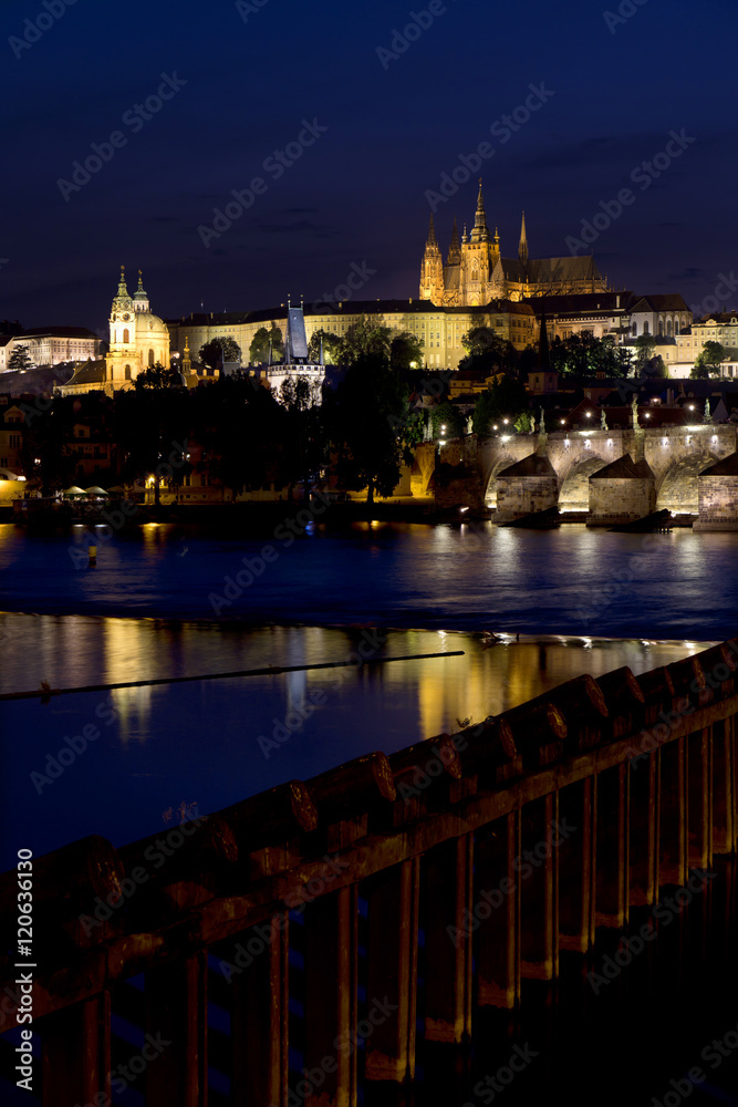 Night colorful Prague gothic Castle above the River Vltava with Charles Bridge, Czech Republic