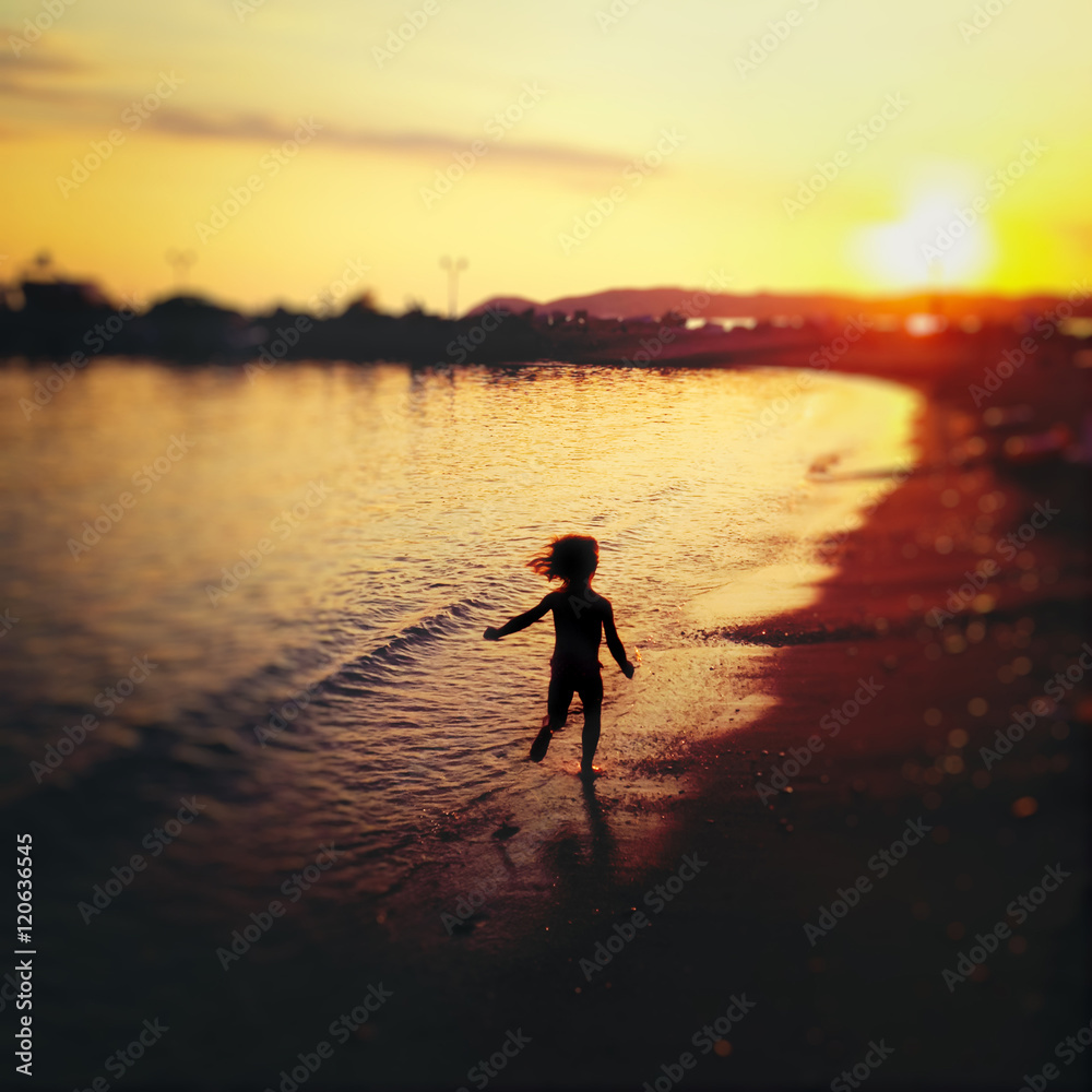  Carefree child running on beach