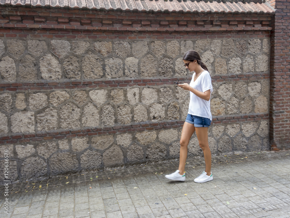 Girl using the phone Girl using the phone