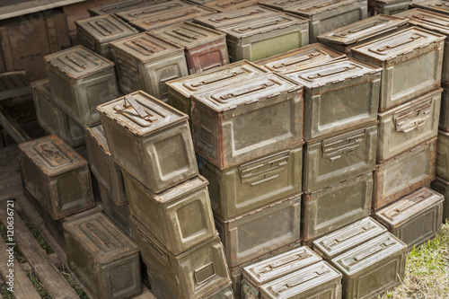 A stack of ammunition tins
 full of bullets.