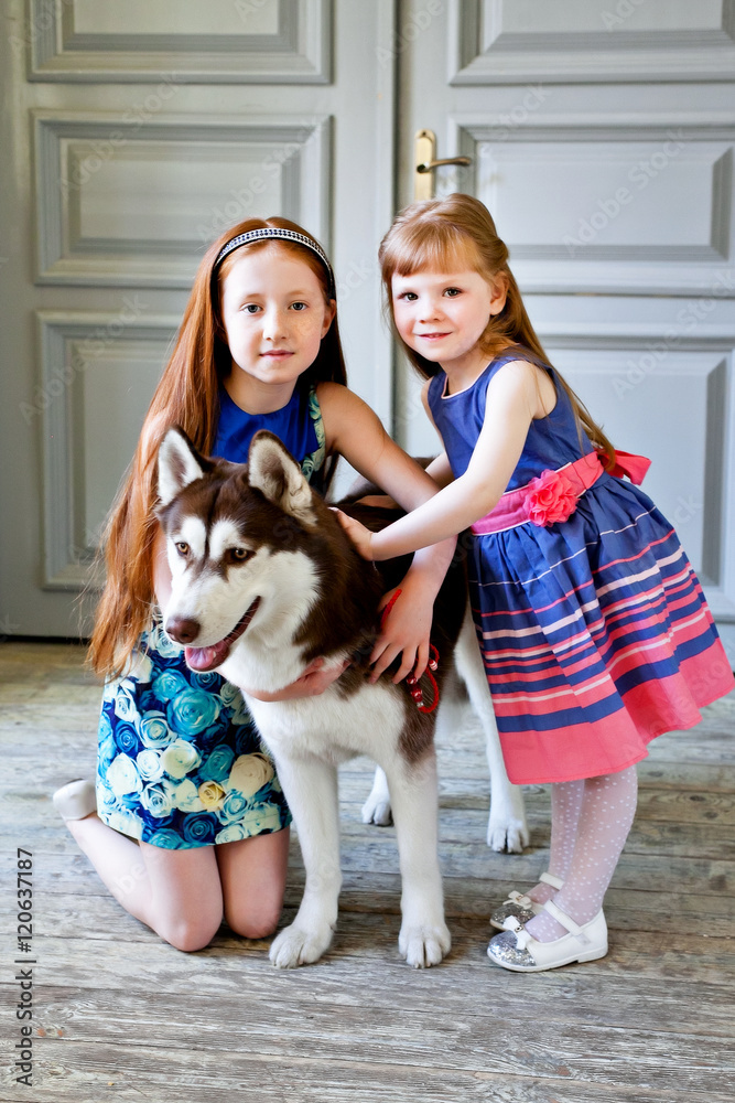 Two red-haired girl with the dog Laika Two red-haired girl with the dog Laika