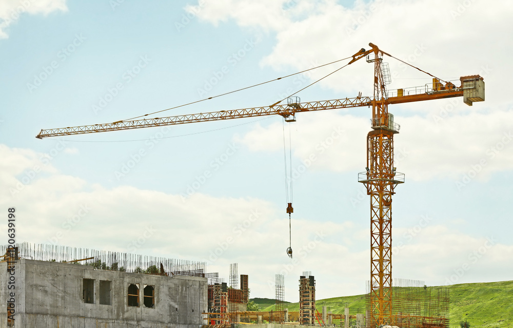 Construction site with crane on blue sky background