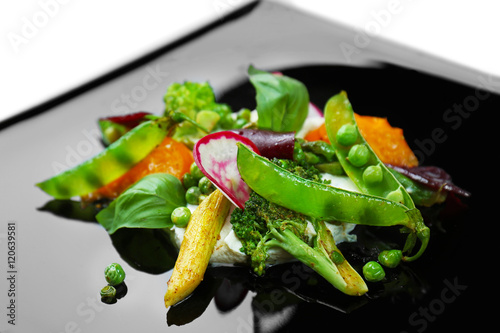Fototapeta Naklejka Na Ścianę i Meble -  Grilled vegetable salad on black plate