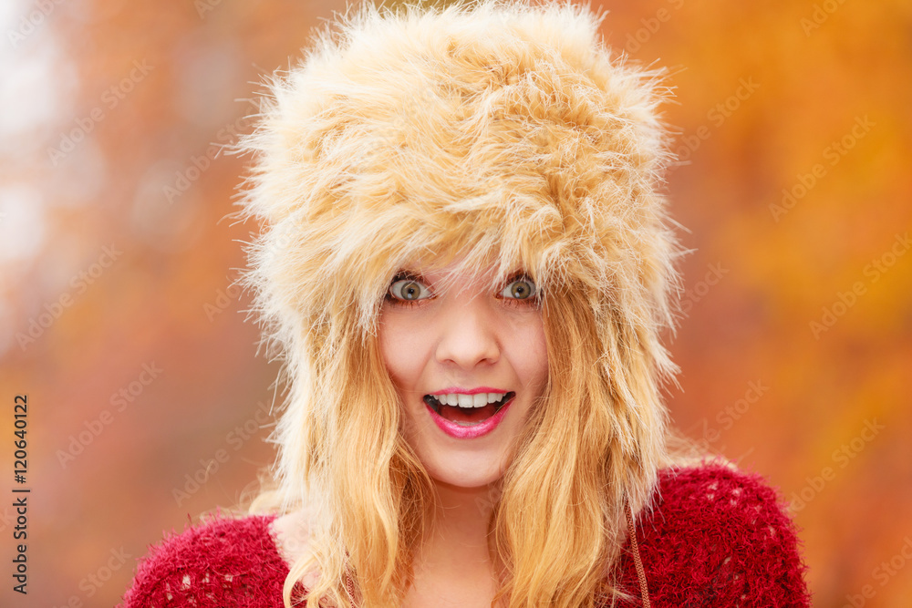Portrait of pretty smiling woman in fur winter hat Portrait of pretty smiling woman in fur winter hat