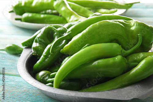 Green peppers on metal plate, closeup