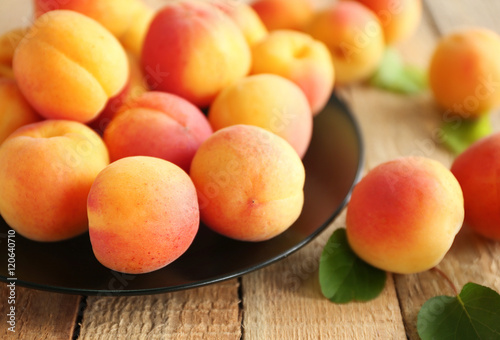 Fresh apricots on plate