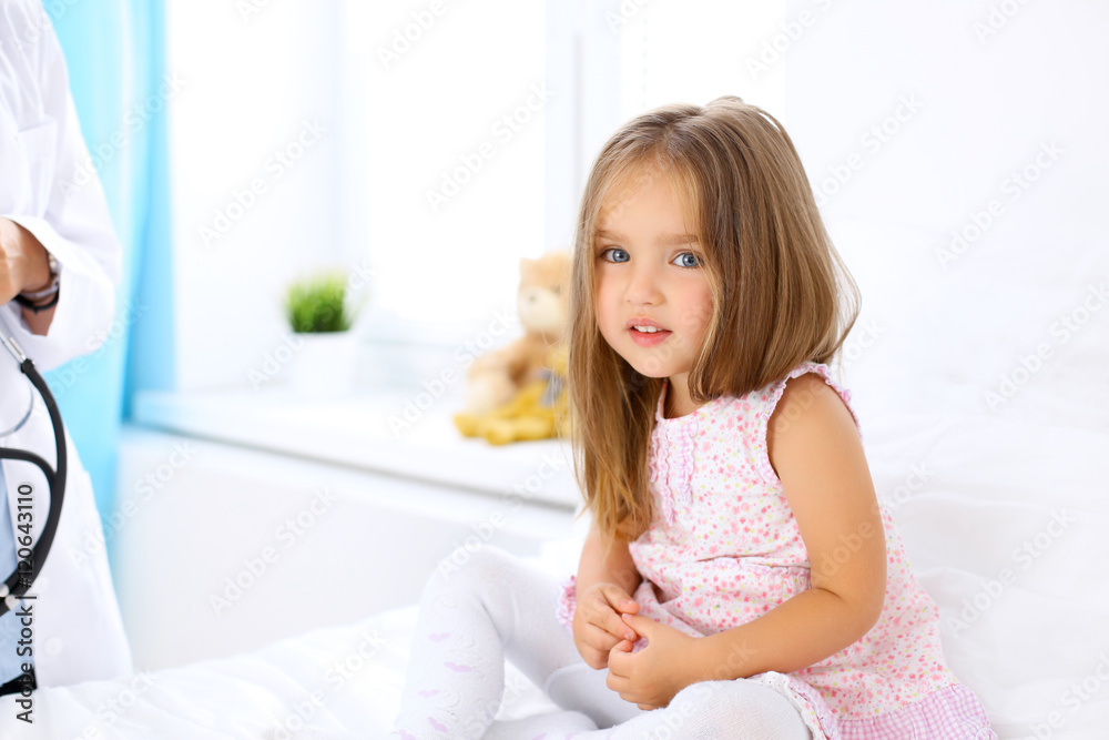 Little girl is feeling pain while doctor examine her in hospital Little girl is feeling pain while doctor examine her in hospital
