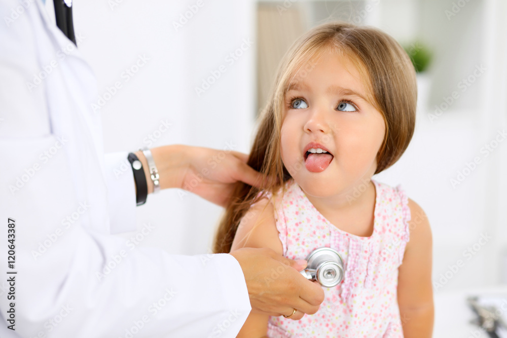 Doctor examining a little girl by stethoscope Doctor examining a little girl by stethoscope