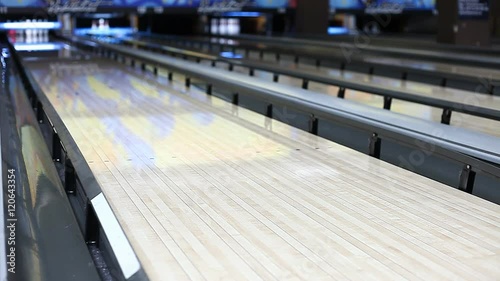 people play bowling, blurred background