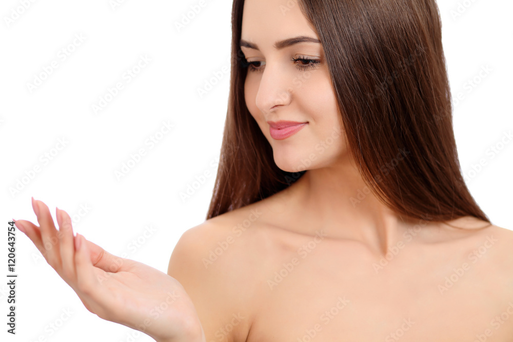 Beauty Spa Woman with perfect skin Portrait. Beautiful Brunette Spa Girl showing empty copy space on the open hand palm for text. Proposing a product. Gestures for advertisement. Isolated background Beauty Spa Woman with perfect skin Portrait. Beautiful Brunette Spa Girl showing empty copy space on the open hand palm for text. Proposing a product. Gestures for advertisement. Isolated background