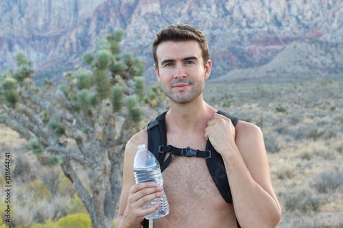 Photography Active man trekking along desert, walking alone in the dry rocky mountains, disc