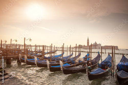 Gondolas parked at San Marco district at sunset © a_kazarin