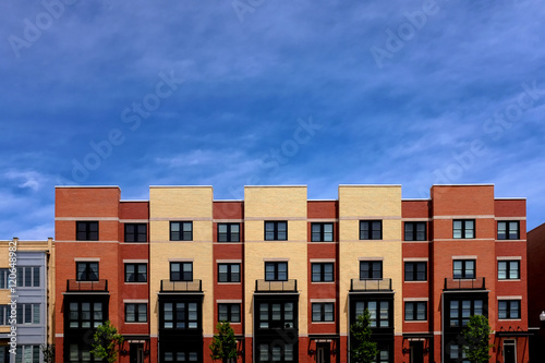 Modern apartment buildings on a sunny day with a blue sky