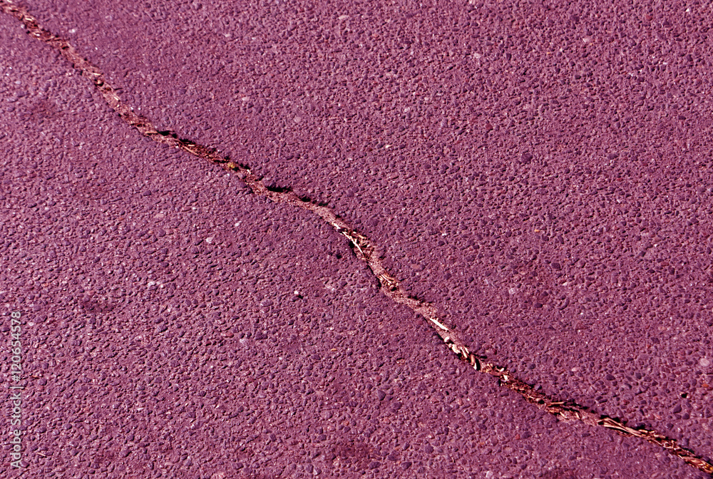 Obraz premium Cracked color asphalt surface.